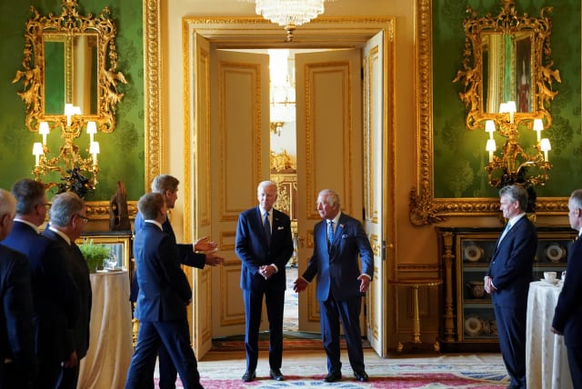  United States Special Presidential Envoy for Climate John Kerry speaks to U.S. President Joe Biden and Britain's King Charles during a climate engagement with philanthropists and investors at Windsor Castle, in Windsor, Britain, July 10, 2023.  (photo credit: REUTERS/Kevin Lamarque/POOL)