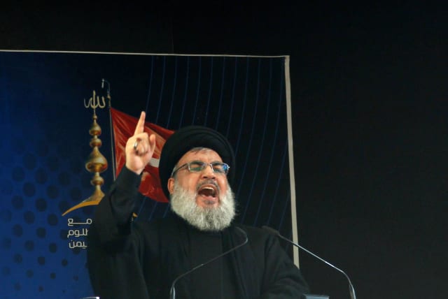 Lebanon's Hezbollah leader Sayyed Hassan Nasrallah addresses his supporters during a public appearance at a religious procession to mark Ashura in Beirut's southern suburbs, Lebanon October 12, 2016 (photo credit: AZIZ TAHER/REUTERS)