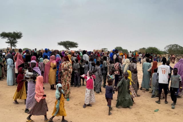  Sudanese people, who fled the violence in their country and newly arrived, wait to be registered at the camp near the border between Sudan and Chad in Adre, Chad April 26, 2023.  (photo credit: REUTERS/Mahamat Ramadane//File Photo)