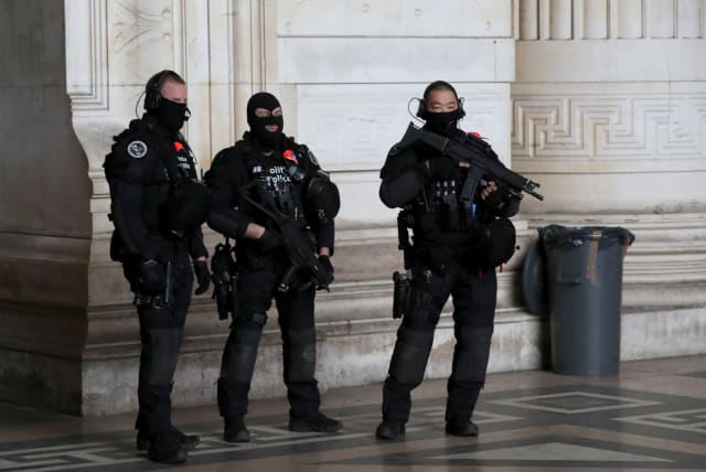  Police special unit secures the Palace of Justice during the trial of Mehdi Nemmouche and Nacer Bendrer, who are suspected of killing four people in a shooting at Brussels' Jewish Museum in 2014, in Brussels, Belgium March 7, 2019.  (photo credit: REUTERS/YVES HERMAN)