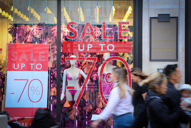 Shoppers walk past sale signs on Oxford Street, as Britain struggles with the highest inflation rate among the world's big rich economies, London, Britain, 17 July 2023 (photo credit: REUTERS/RACHEL ADAMS)