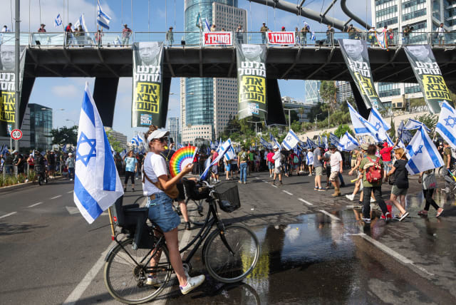  People demonstrate on the 'Day of National Resistance' in protest against Israeli Prime Minister Benjamin Netanyahu and his nationalist coalition government's judicial reform, in Tel Aviv, Israel July 18, 2023. (photo credit: NIR ELIAS / REUTERS)