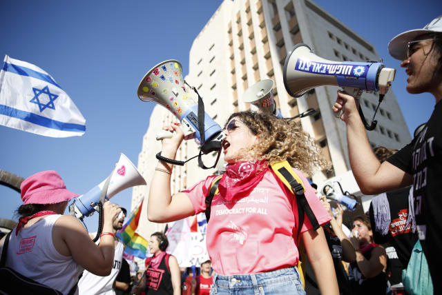 Anti-judicial overhaul demonstrators protest against the judicial overhaul in Haifa. July 20, 2023. (photo credit: SHIR TOREM/FLASH90)