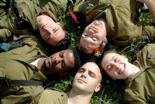 IDF soldiers laying on grass. (photo credit: Wikimedia Commons)