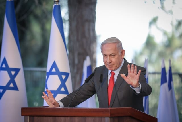  Israeli Prime Minister Benjamin Netanyahu is seen speaking at a memorial ceremony for Ze'ev Jabotinsky on Mount Herzl, in Jerusalem, on July 18, 2023. (photo credit: NOAM REVKIN FENTON/FLASH90)