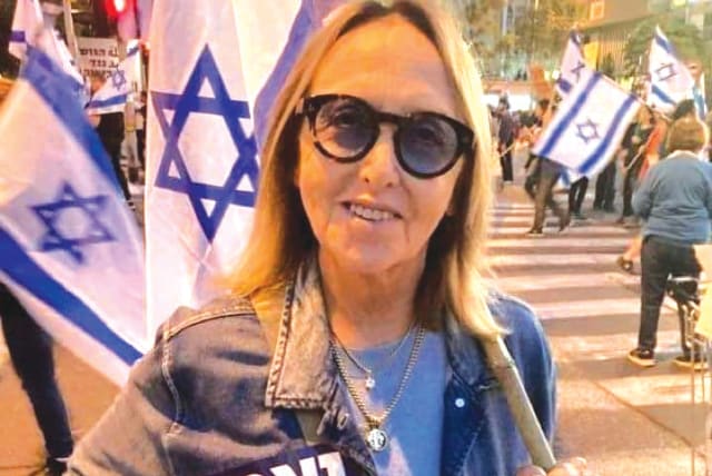  SHELLEY GOLDMAN protests at Kaplan Street in Tel Aviv. Her sticker reads: ‘Loyal to the Declaration of Independence.’ (photo credit: Shelley Goldman)