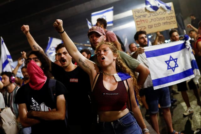  Protesters block Ayalon Highway during a demonstration following a parliament vote on a contested bill that limits Supreme Court powers to void some government decisions, in Tel Aviv, Israel July 25, 2023 (photo credit: CORINNA KERN/REUTERS)