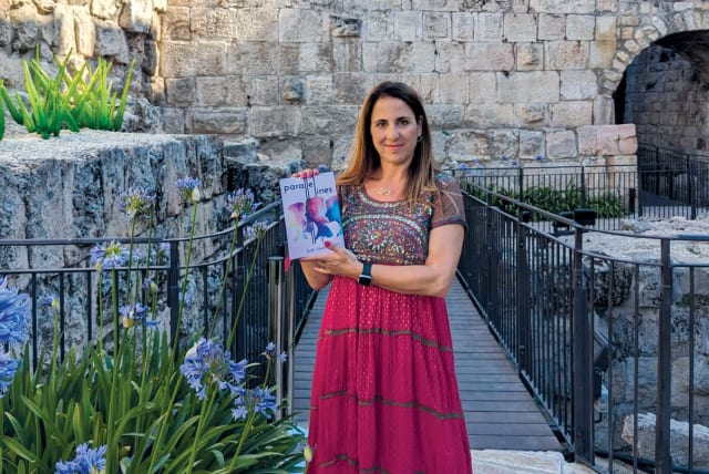  Ruth Marks Eglash holding her new book at the Tower of David Museum. (photo credit: MIRIAM ABRAMOWITZ SHAVIV)