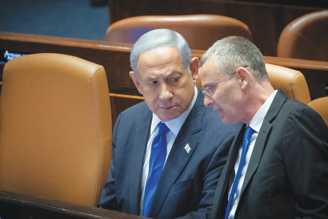  JUSTICE MINISTER Yariv Levin speaks with Prime Minister Benjamin Netanyahu during the voting in the Knesset plenum on Monday. (photo credit: YONATAN SINDEL/FLASH90)
