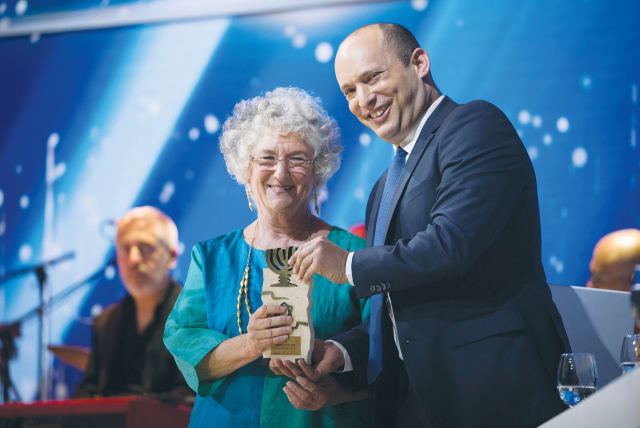  THEN-EDUCATION minister Naftali Bennett with Israeli Prize winner, anthropologist Deborah Bernstein, at the Israel Prize ceremony in Jerusalem in 2019.  (photo credit: YONATAN SINDEL/FLASH90)