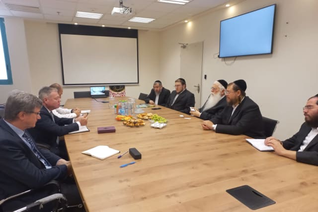  Jerusalem Affairs and Jewish Tradition Minister Meir Porush is seen meeting with Ukraine's Ambassador to Israel Yevgeny Kornichuk to discuss pilgrimages to Uman. (photo credit: Jerusalem Affairs and Jewish Tradition Ministry)