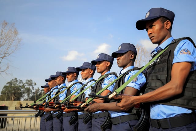  Addis Ababa police officers, take part in a parade displaying their new uniforms, and their readiness for the upcoming Ethiopian parliamentary and regional elections in Addis Ababa, Ethiopia, June 19, 2021. (photo credit: Tiksa Negeri/Reuters)