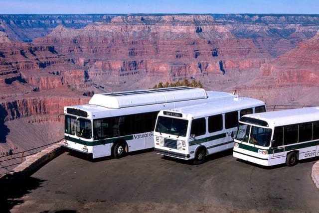  Three buses parked on a ledge overlooking the Grand Canyon in Arizona, US. (photo credit: PICRYL)