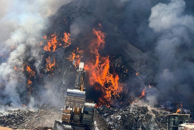  Fire at illegal trash dumping ground caused dangerous air pollution level in Binyamin region of the West Bank, on August 7, 2023. (photo credit: TOVAH LAZAROFF)