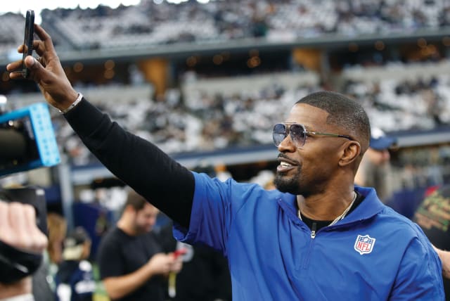  ACTOR JAIME FOXX on the sidelines before an American football game, in Arlington, Texas, in 2021: After coming under fire, Foxx has deleted his post that Jews killed Jesus, and has published an apology.  (photo credit: Tim Heitman/USA TODAY Sports/Reuters)