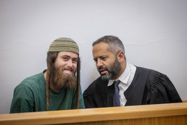  Elisha Yered, suspected of being involved in the death of 19-year-old Palestinian Qusai Jamal Maatan in the West Bank village of Burqa, arrives for a hearing at the District Court in Jerusalem, August 8, 2023 (photo credit: Chaim Goldberg/Flash90)