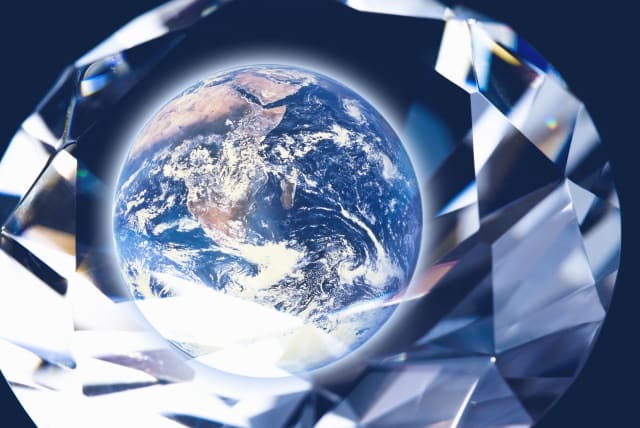  An illustrative image of a diamond over a picture of the Earth. (photo credit: INGIMAGE)