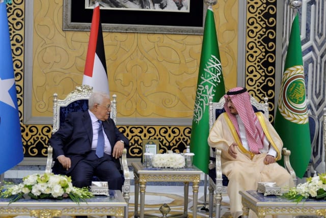  Palestinian President, Mahmoud Abbas, is received by Deputy Amir of Makkah, Prince Badr Bin Sultan, as he arrives to attend the Arab League Summit in Jeddah, Saudi Arabia, May 18, 2023 (photo credit: SAUDI PRESS AGENCY/HANDOUT VIA REUTERS)