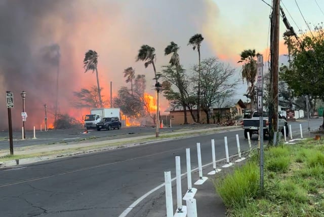 Smoke and flames rise in Lahaina, Maui County, Hawaii, U.S., August 8, 2023 in this still image from video obtained from social media. (photo credit: Jeff Melichar/TMX/via REUTERS)
