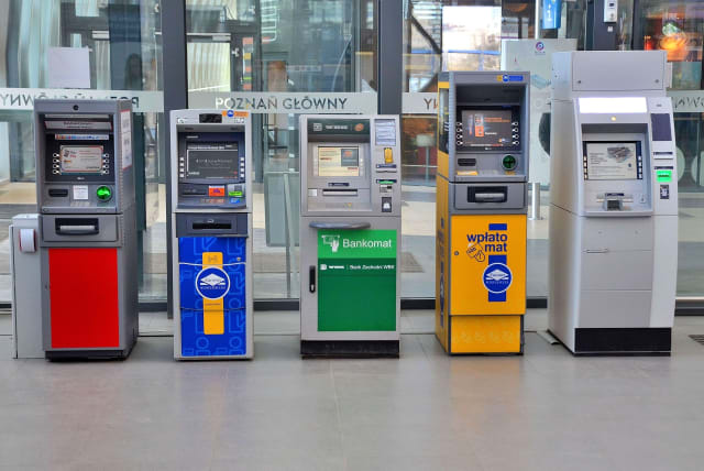  ATMs at the Poznań Główny railway station in Poznań, Poland. (photo credit: ADRIAN GRYCUK/WIKIMEDIA COMMONS)
