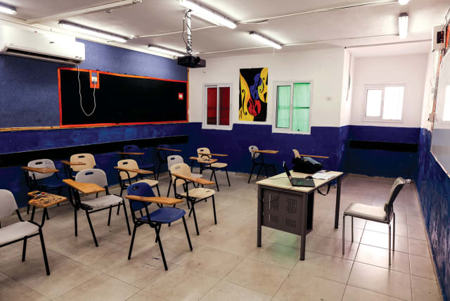  AN EMPTY classroom in an east Jerusalem school, closed in protest at ‘Israeli censorship’ of PA-autorized school textbooks, last year.  (photo credit: AMMAR AWAD/REUTERS)
