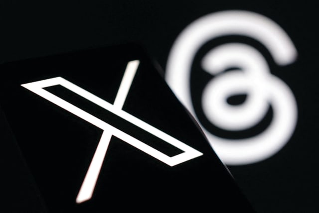  AN ILLUSTRATION of the new logo of X (Twitter) is seen with the logo of Meta’s Threads. (photo credit: DADO RUVIC/REUTERS)