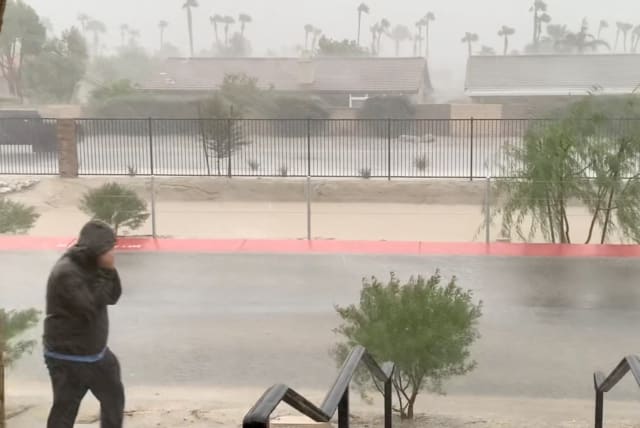  Strong winds and rain are seen from a residence as Tropical Storm Hilary approaches, in Cathedral City, California, U.S. August 20, 2023 in this screen grab obtained from social media video. (photo credit: Harry Parrish/via REUTERS)