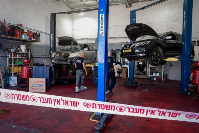  Police at the scene where a worker at a garage stabbed by a Jordanian worker in a suspect terror stabbing attack, in Petah Tikva, August 10, 2023 (photo credit: AVSHALOM SASSONI/FLASH90)
