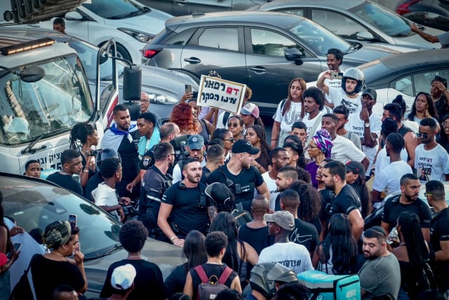 Members of the Jewish Ethiopian community and overs block the Ayalon Highway in Tel Aviv, during a protest demand justice for to 4-year-old Rafael Adana, who was run over and killed in a car accident in Netanya, August 21, 2023.  (photo credit: AVSHALOM SASSONI/FLASH90)