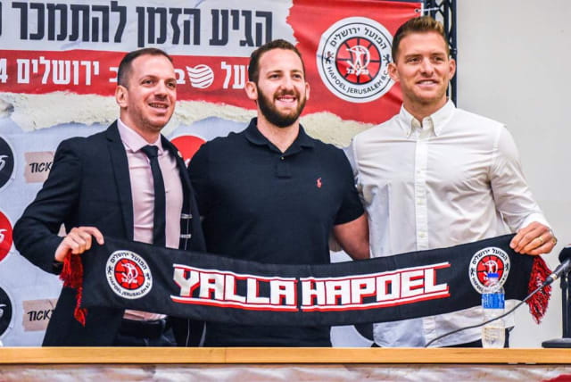  HAPOEL JERUSALEM owner Matan Adelson (center) poses with new team executives Gal Mekel (right) and Alon Kremer (left) at their introductory press conference this week (photo credit: YEHUDA HALICKMAN)