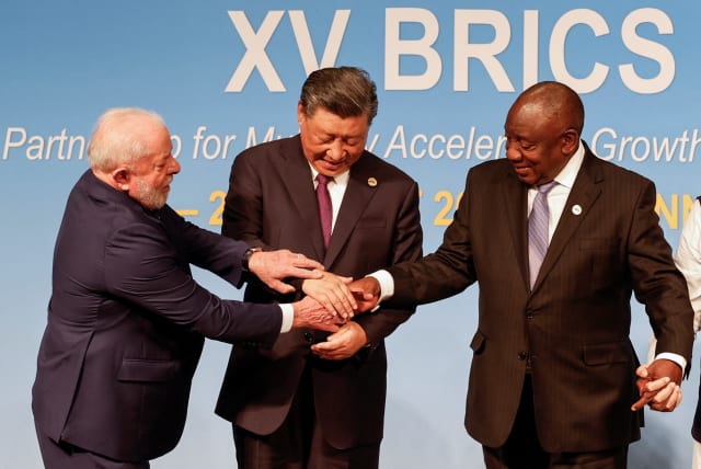  President of Brazil Luiz Inacio Lula da Silva, President of China Xi Jinping and South African President Cyril Ramaphosa gesture during the 2023 BRICS Summit at the Sandton Convention Centre in Johannesburg, South Africa on August 23, 2023 (photo credit: GIANLUIGI GUERCIA/POOL VIA REUTERS)