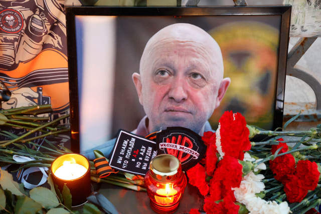  A view shows a portrait of Wagner mercenary chief Yevgeny Prigozhin at a makeshift memorial in Moscow, Russia August 24, 2023. (photo credit: REUTERS/STRINGER)
