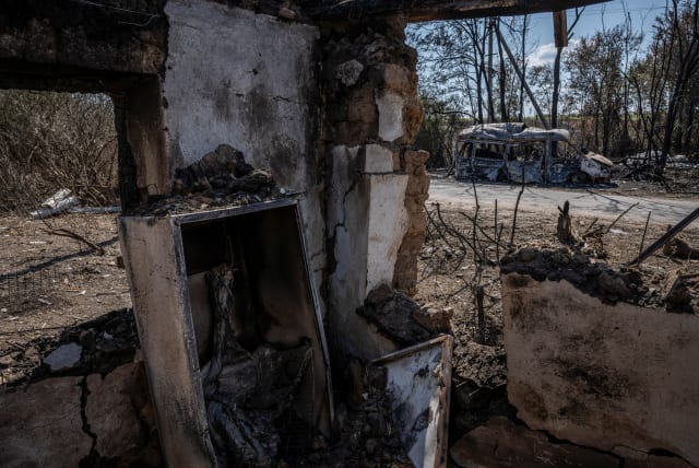  A destroyed car is seen from a destroyed building, as Russia's attack on Ukraine continues, near the village of Robotyne, Zaporizhzhia region, Ukraine August 25, 2023. (photo credit: REUTERS/Viacheslav Ratynskyi)