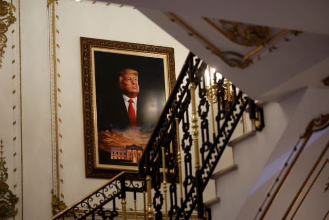  A portrait of former US President Donald Trump over the White House is seen on a stairway of his Mar-a-Lago estate. (photo credit: REUTERS/JONATHAN ERNST)