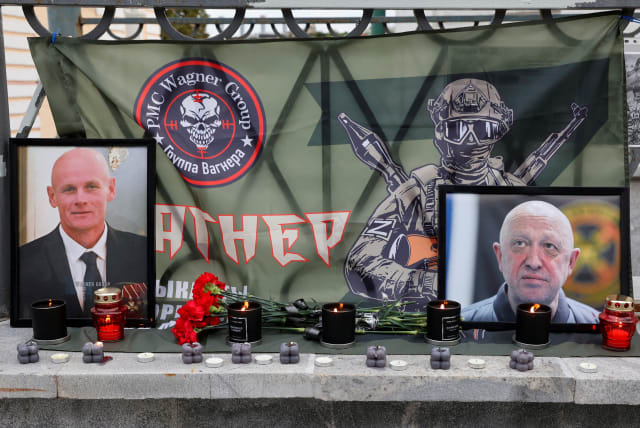  A view shows portraits of Russian mercenary chief Yevgeny Prigozhin and Wagner group commander Dmitry Utkin at a makeshift memorial in Moscow, Russia August 24, 2023. (photo credit: REUTERS/STRINGER)