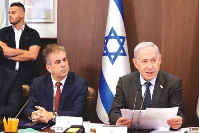  FOREIGN MINISTER Eli Cohen sits next to Prime Minister Benjamin Netanyahu at a cabinet meeting in Jerusalem in July. (photo credit: MARC ISRAEL SELLEM/THE JERUSALEM POST)