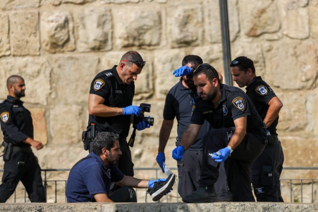  Police officers at the scene of suspected stabbing attack on Jaffa Gate outside Jerusalem's Old City. September 6, 2023.  (photo credit: Chaim Goldberg/Flash90)