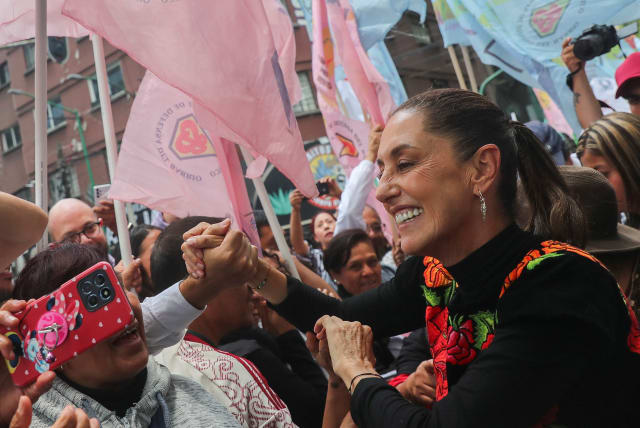 Former Mexico City Mayor Claudia Sheinbaum greets supporters during an event, pursuing to be the ruling MORENA party's candidate for the 2024 presidential election, in Mexico City, Mexico, August 26, 2023 (photo credit: REUTERS/Raquel Cunha)