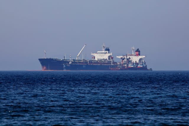  The Liberian-flagged oil tanker Ice Energy transfers crude oil from the Iranian-flagged oil tanker Lana (former Pegas), off the shore of Karystos, on the Island of Evia, Greece, May 26, 2022. (photo credit: REUTERS/COSTAS BALTAS)