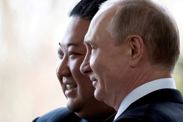  Russian President Vladimir Putin and North Korea's leader Kim Jong Un pose for a photo during their meeting in Vladivostok, Russia, April 25, 2019. Picture taken April 25, 2019. (photo credit: ALEXANDER ZEMLIANICHENKO/POOL VIA REUTERS)
