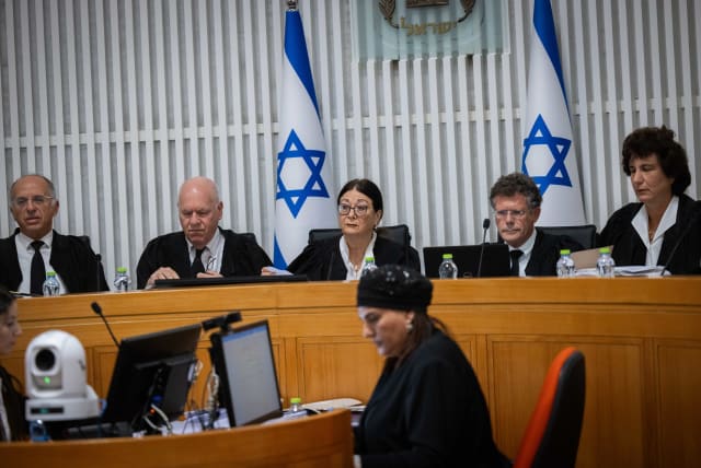  High Court of Justice President Esther Hayut and the other Supreme Court justices are seen at a hearing over petitions against the reasonableness standard law, in Jerusalem, on September 12, 2023. (photo credit: YONATAN SINDEL/FLASH90)