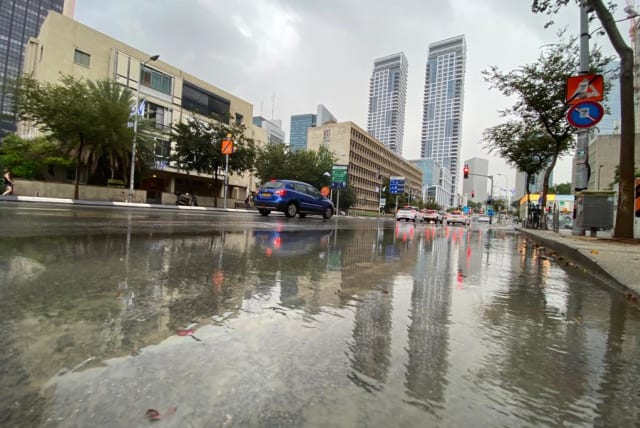 An overflowing Kaplan Street in Tel Aviv is seen on September 13, 2023 following heavy rains in central Israel (photo credit: AVSHALOM SASSONI/MAARIV)
