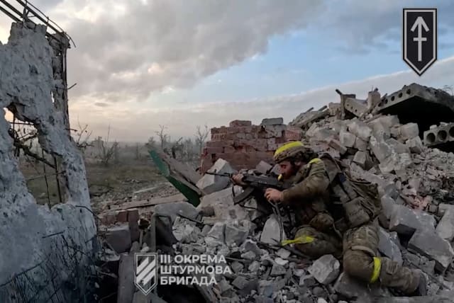 A view of a Ukrainian soldier during the purported liberation of Andriivka, at a location given as Andriivka, Donetsk Region, Ukraine, in a screen grab obtained from a handout video released September 16, 2023. (photo credit: 3rd assault brigade/Ukrainian Armed Forces Press service/Handout via REUTERS)