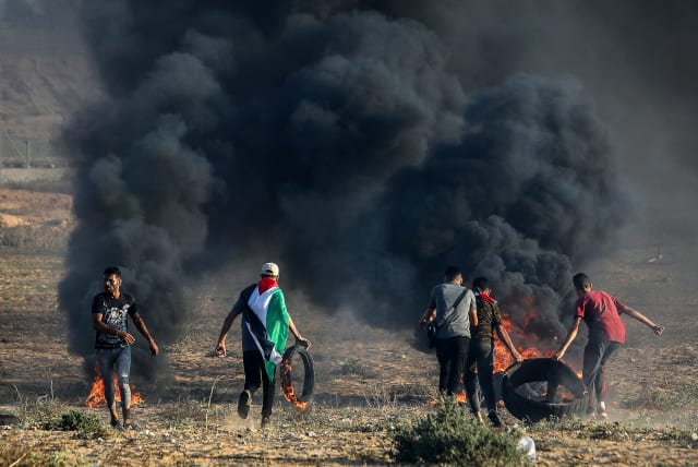  Palestinian demonstrators clash with Israeli soldiers at the Israel-Gaza border fence, east of Khan Yunis, in the southern Gaza Strip. September 19, 2023 (photo credit: ABED RAHIM KHATIB/FLASH90)