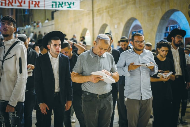  PRAYERS FOR forgiveness are recited before Yom Kippur, at the Western Wall.  (photo credit: Arie Leib Abrams/Flash90)