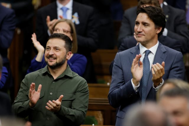  Canadian Prime Minister Justin Trudeau and Ukraine's President Volodymyr Zelenskiy react following his speech at the House of Commons on Parliament Hill in Ottawa, Ontario, Canada September 22, 2023. (photo credit: REUTERS/Blair Gable/Pool)