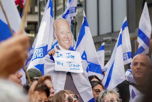  A view of a placard depicting US President Joe Biden at a demonstration by pro-democracy Israelis and Israeli Americans near the Intercontinental Hotel, where Israeli Prime Minister Benjamin Netanyahu met with Biden on the sidelines of the UN General Assembly, in New York, U.S., September 2023 (photo credit: REUTERS/BING GUAN)