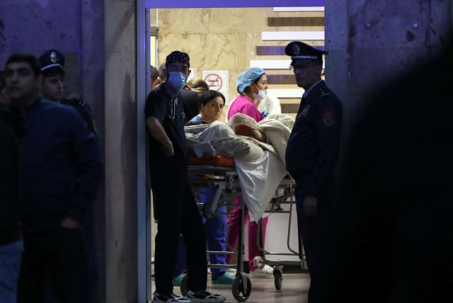  Medics assist a person injured in an explosion at a fuel depot near Stepanakert in the Nagorno-Karabakh region, at the National Burn Center in Yerevan, Armenia September 26, 2023. (photo credit: Hayk Baghdasaryan/Photolure via REUTERS)