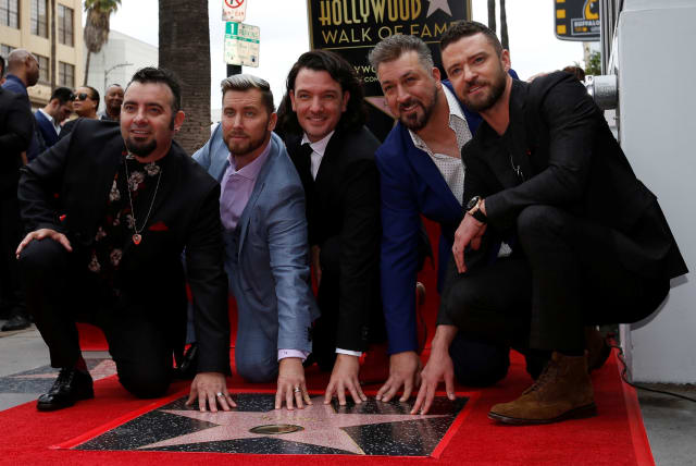  American boy band *NSYNC pose during the unveiling ceremony of their star on the Hollywood Walk of Fame in Los Angeles, U.S. April 30, 2018. (photo credit:  REUTERS/Mario Anzuoni)