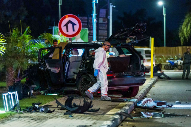  Police officers at the scene where one person was killed and two were injured in a car bomb assassination in Moshav Hatsav, October 1, 2023.  (photo credit: LIRON MOLDOVAN/FLASH 90)